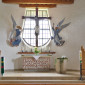 Die Kreuzkirche wurde nach Plänen von Gustav Gsaenger aus München 1952/53 erbaut und 1960 durch einen Anbau erweitert. So verfügt sie über 250 Sitzplätze. Die Altargruppe - Kruzifix und zwei Engel - schuf Andreas Schwarzkopf aus Ruhpolding.